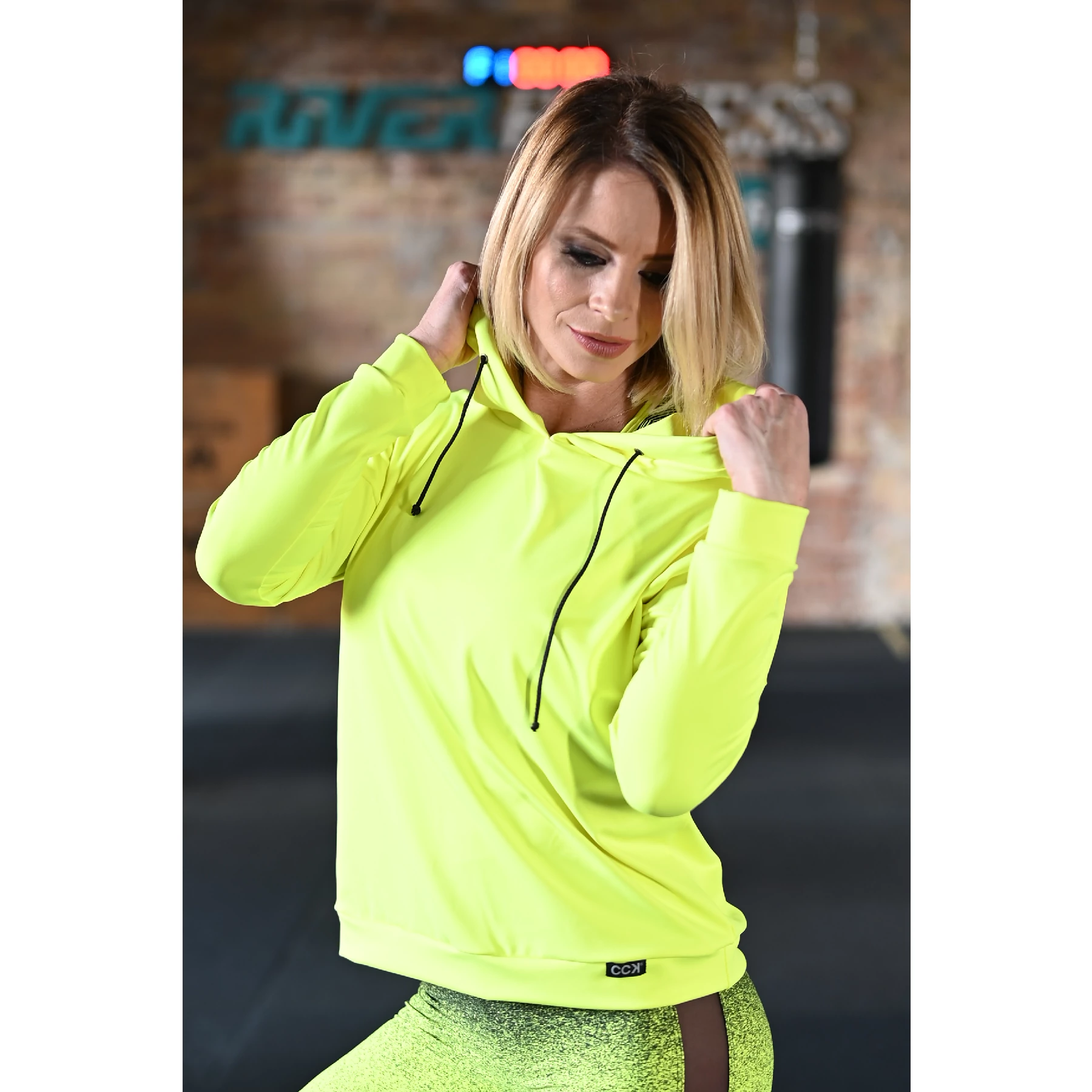 Kapucnis fitnesz felső, neonsárga